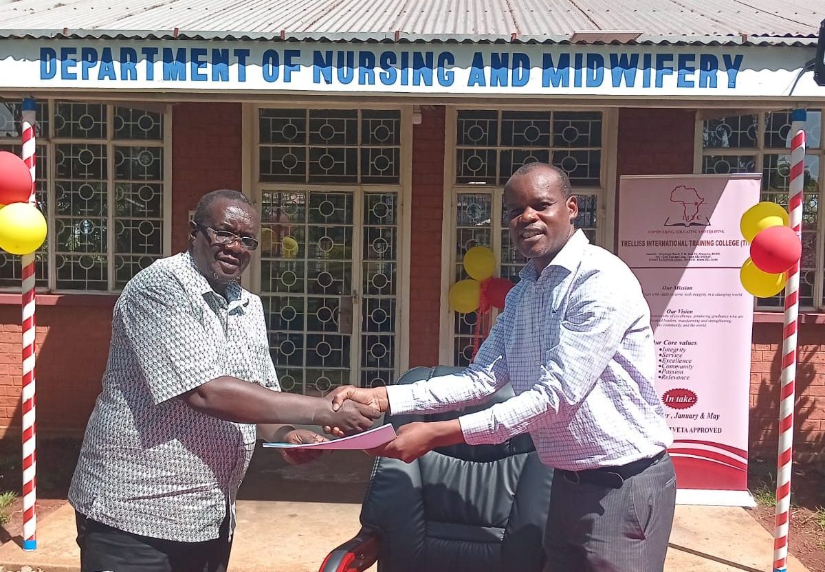 Principal TITC signing MoU with Kima Mission Hospital